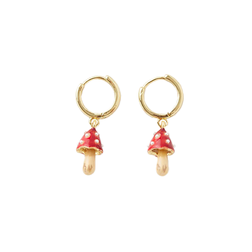 A pair of gold plated huggie earrings with pendants in the shape of red dotted mushrooms.