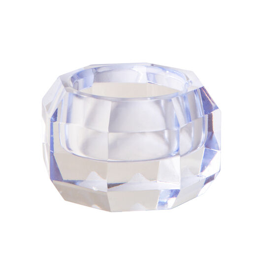 A glass tealight holder with a pale blue hue.